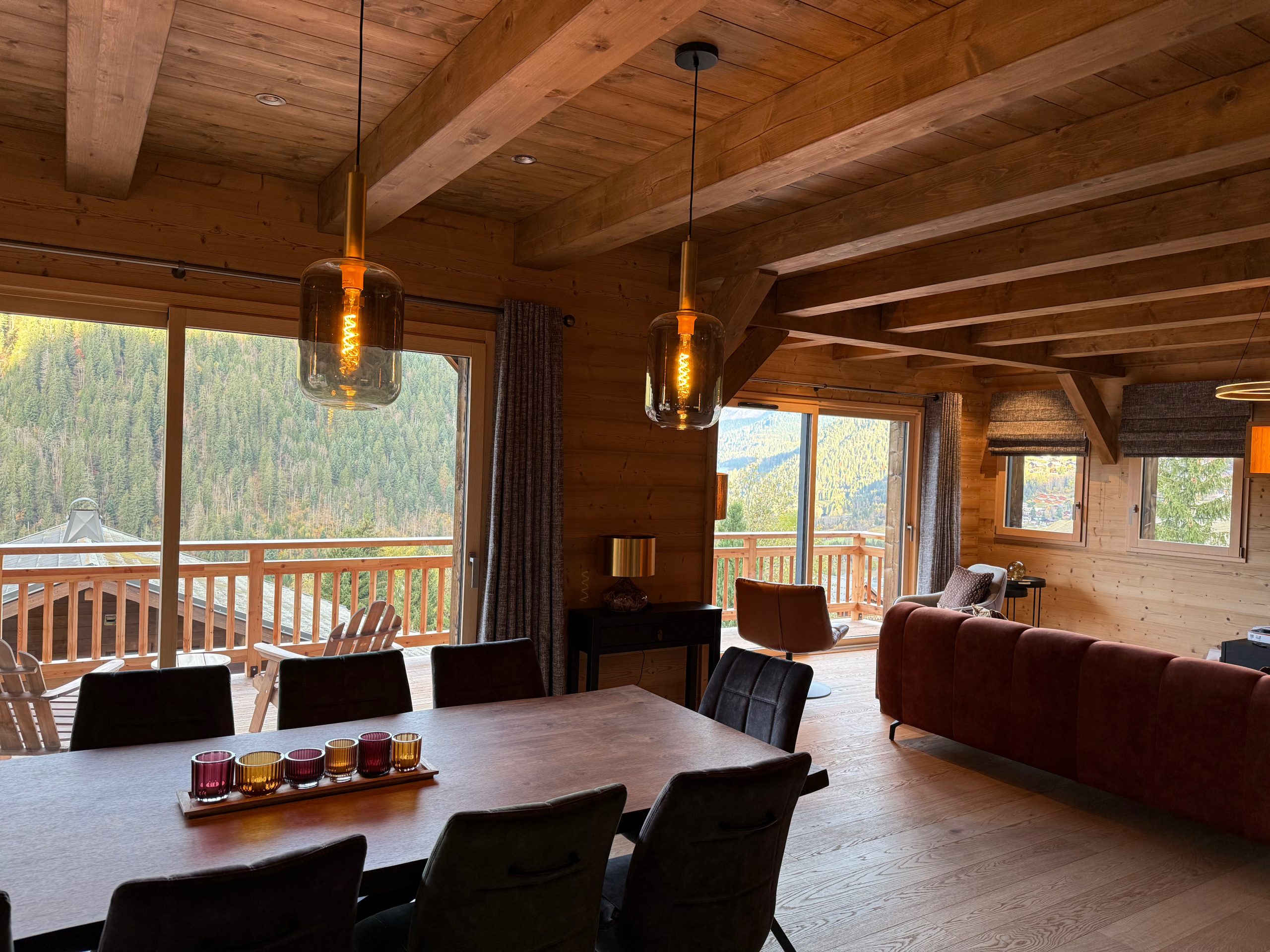 View of tree-lined mountains from a chalet