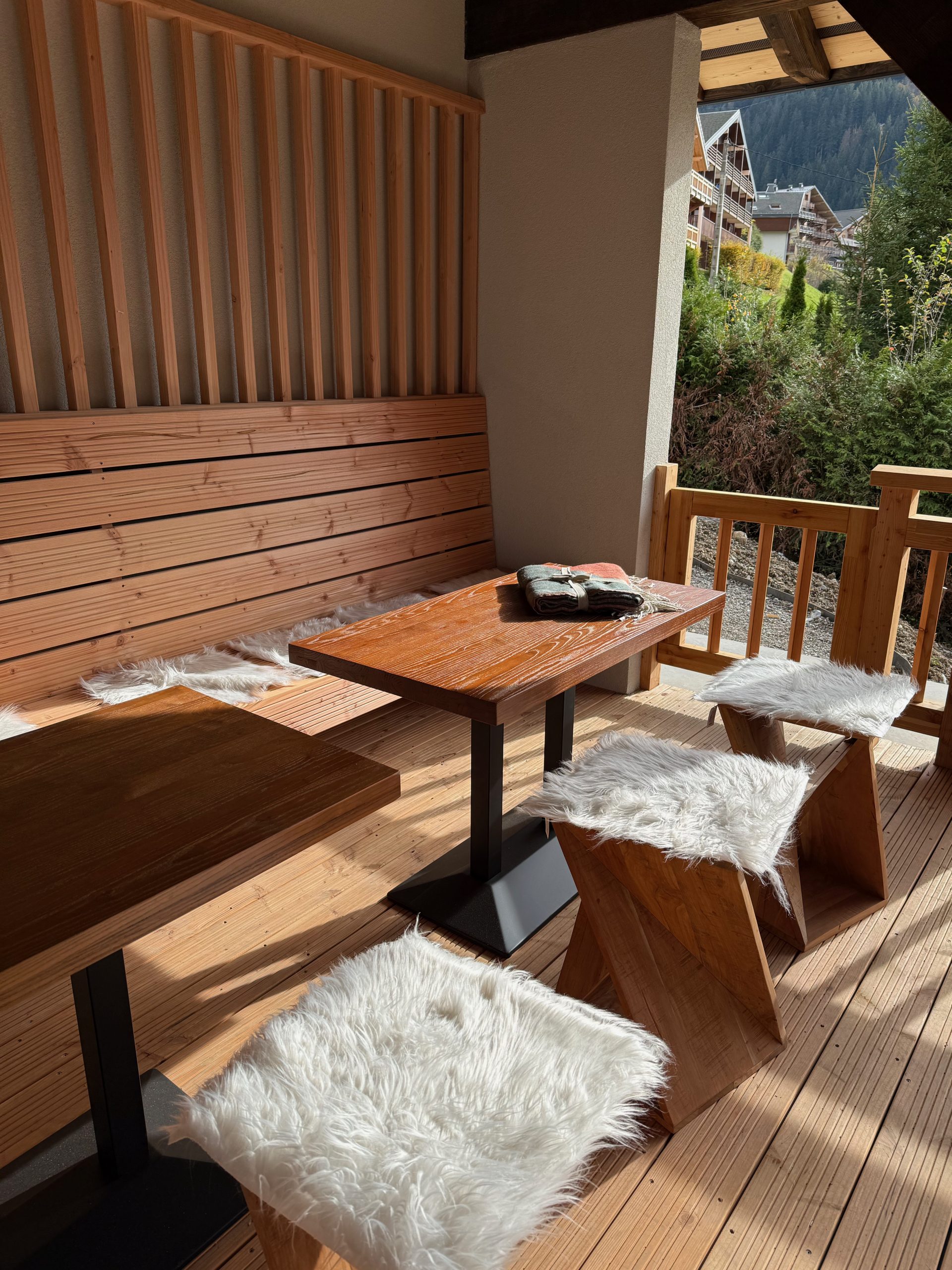 Benches and tables on a chalet terrace